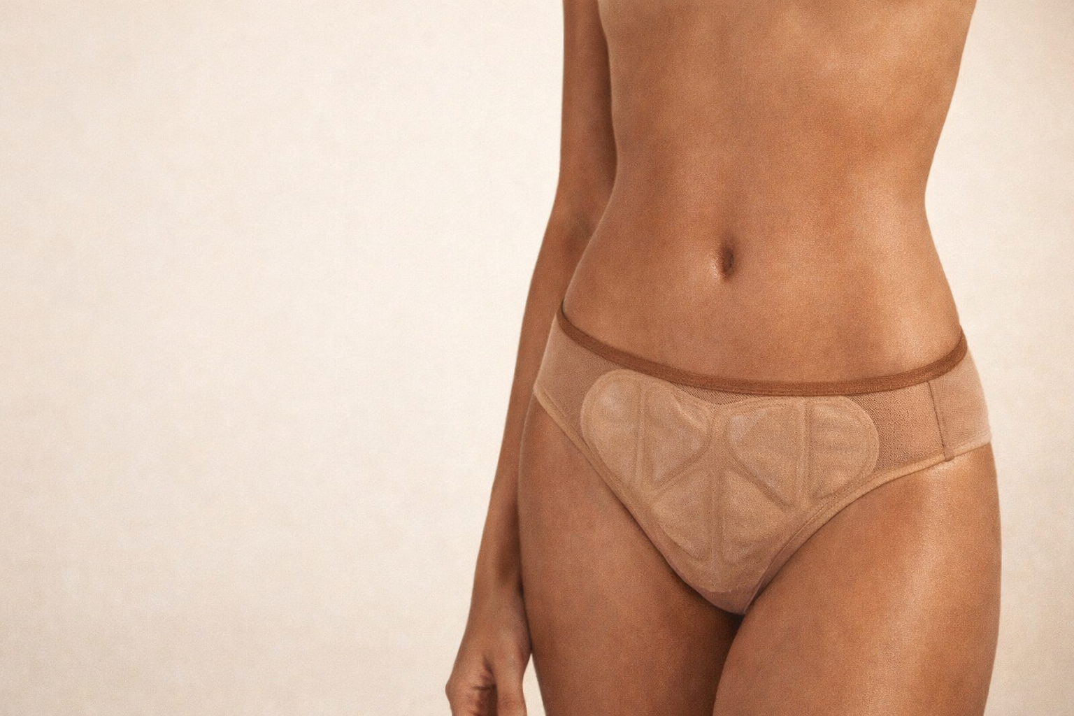 The E heat therapy pad worn discreetly over underwear