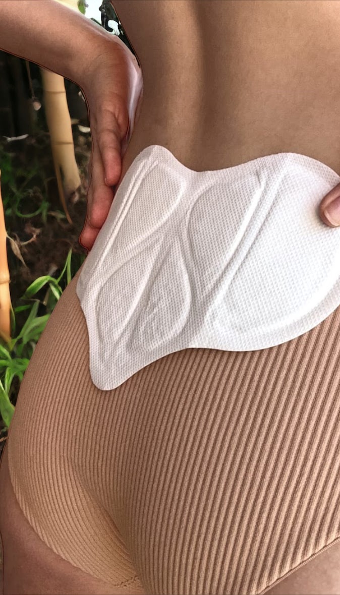 Close-up of the heart-shaped The E heat therapy pad
